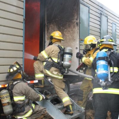 Firefighters entering the simulated fire trailer 6-13-21 Photo by Rhonda Silence.