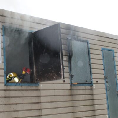 Firefighters extinguished a fire, found the window and vented the smoke in training. 6-13-21 Photo by R. Silence