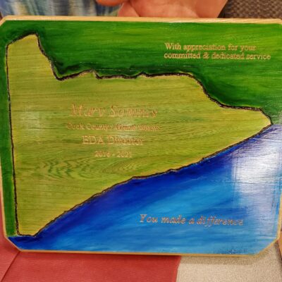 The handcrafted plaque gifted to retiring EDA Director Mary Somnis. Photo by  Rhonda Silence