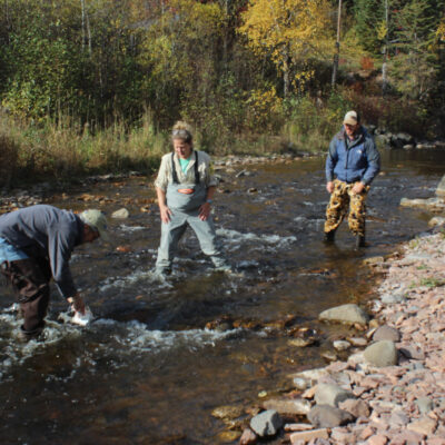 Researchers collect samples of rock snot on the Devil Track River in Oct 2021. Photo by Joe Friedrichs