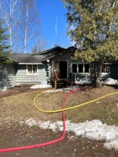 Hose lines were run from Gunflint Lake to the structure fire. 