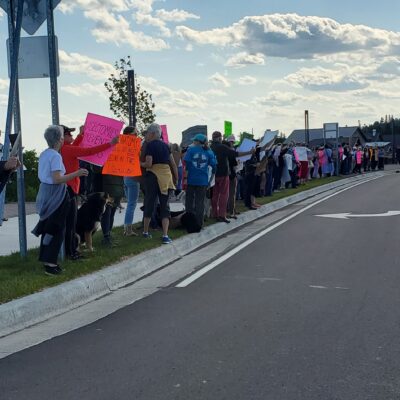 Approximately 150 people lined Highway 61 at the Roe v. Rage Rally on July 1