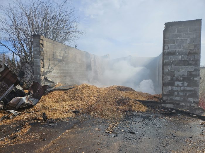 Structure fire destroys wood chip building in Grand Portage