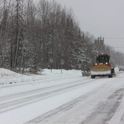 A plow running on County Rd 7 Monday morning