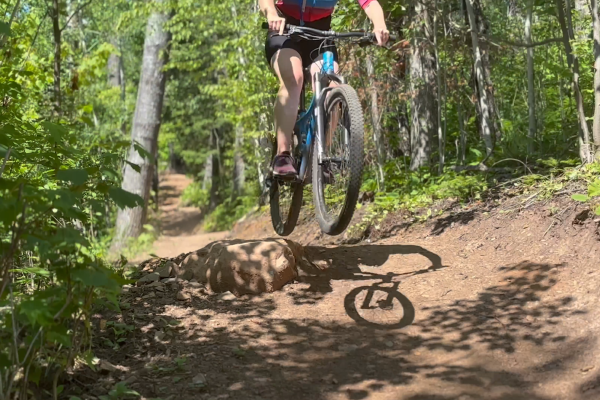 Mountain Biker Hannah Hoaglund takes a small jump on a section of the newly redesigned Pincushion trails.