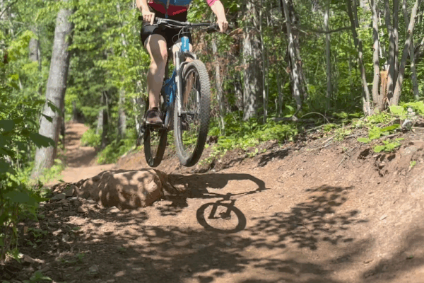 Mountain Biker Hannah Hoaglund takes a small jump on a section of the newly redesigned Pincushion trails.