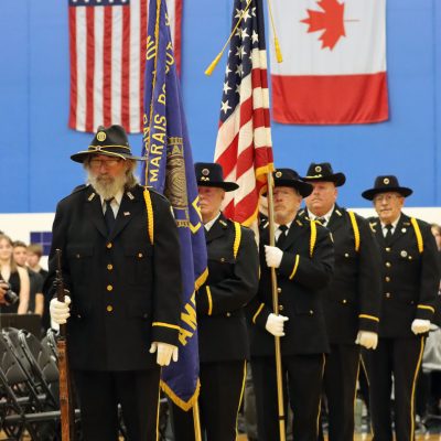 Color Guard exits as TAPS is played