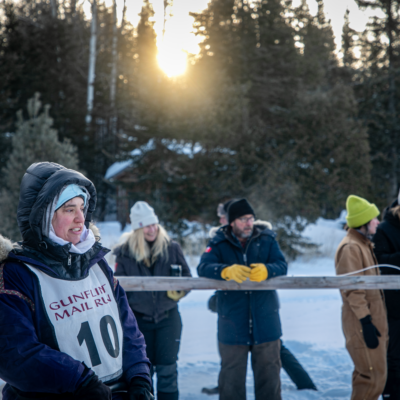 Local Musher Erin Altemus with spectators and volunteer