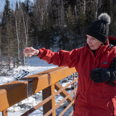 Sharon Hexum-Platzer christening the bridge with champagne