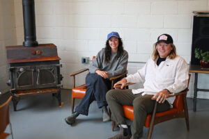 Co-owners Emma Sievers and Tim Saetre with wood-burning stove