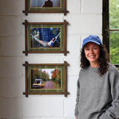 Emma with her father's photographs