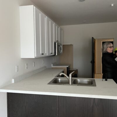a kitchen space in a one bedroom apartment
