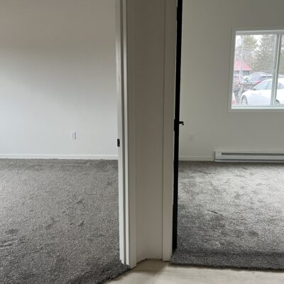 the hallway in a two bedroom unit