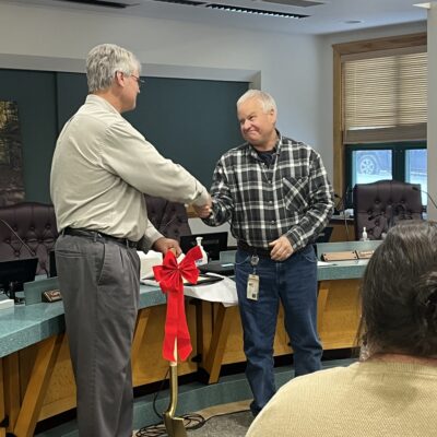 Mitch Everson receiving a golden shovel from Tim Nelson