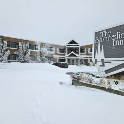 Snow drifts surround vehicle at The Shoreline Inn