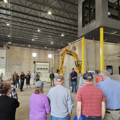 North Shore Waste co-owner Dustin Hanson speaking during the ribbon cutting ceremony