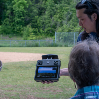 Drone Pilot Ben Belland conducting a drone demonstration to attendees 