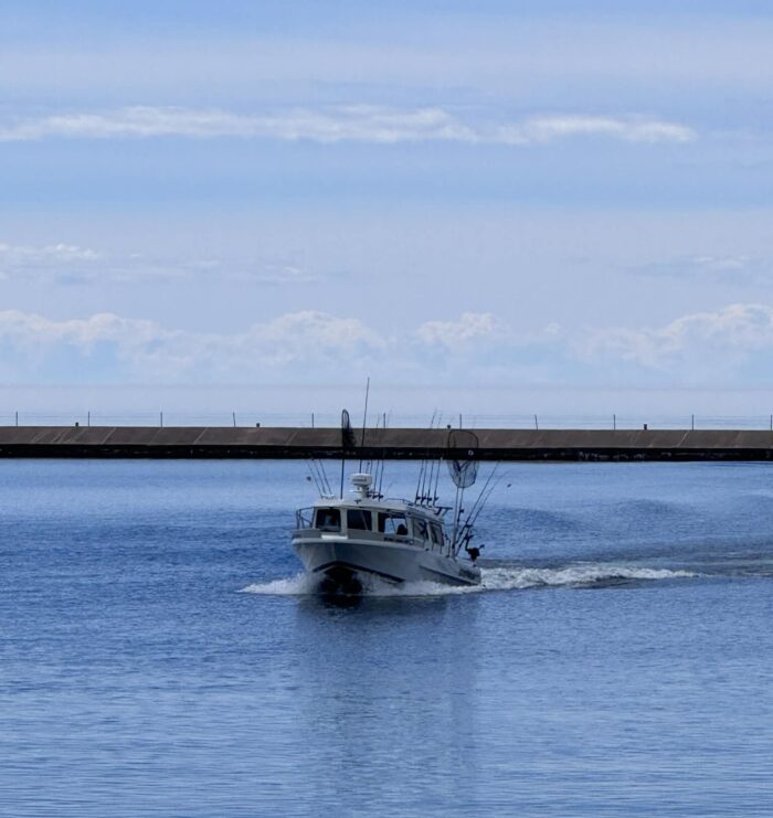 Local fishing charter captains and crew rescue kayaker on Lake Superior